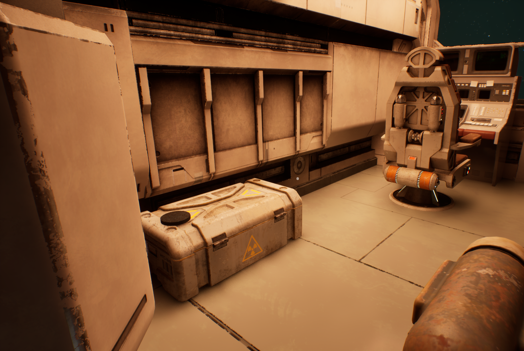 The left side of the cabin, with a footlocker, on the top of which rests a spare filter.
